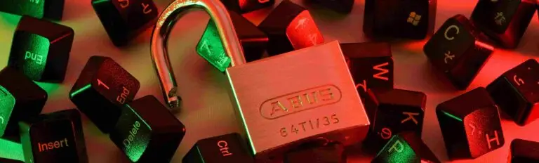 A padlock surrounded by various computer keyboard keys, symbolizing digital security and access control.